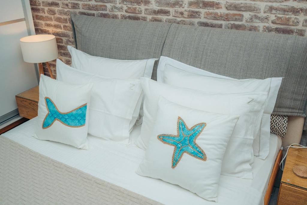 A bed or beds in a room at Erifili Houses