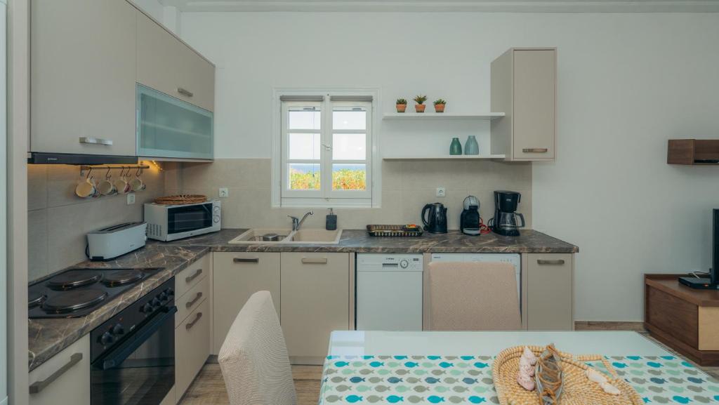 A kitchen or kitchenette at Erifili Houses