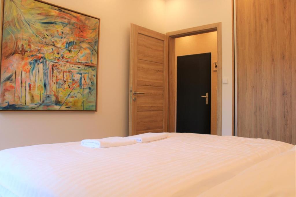 Postel nebo postele na pokoji v ubytování SKI Apartmán Snowcat