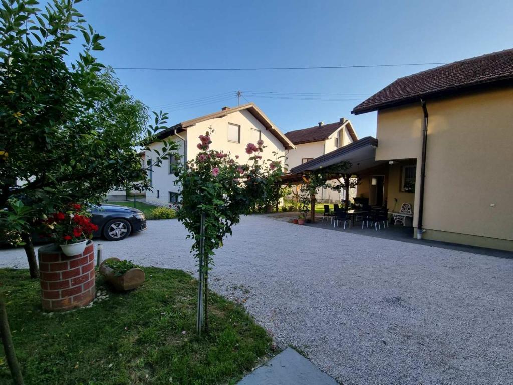 a small tree in the middle of a driveway at Delimustafić apartmani in Visoko