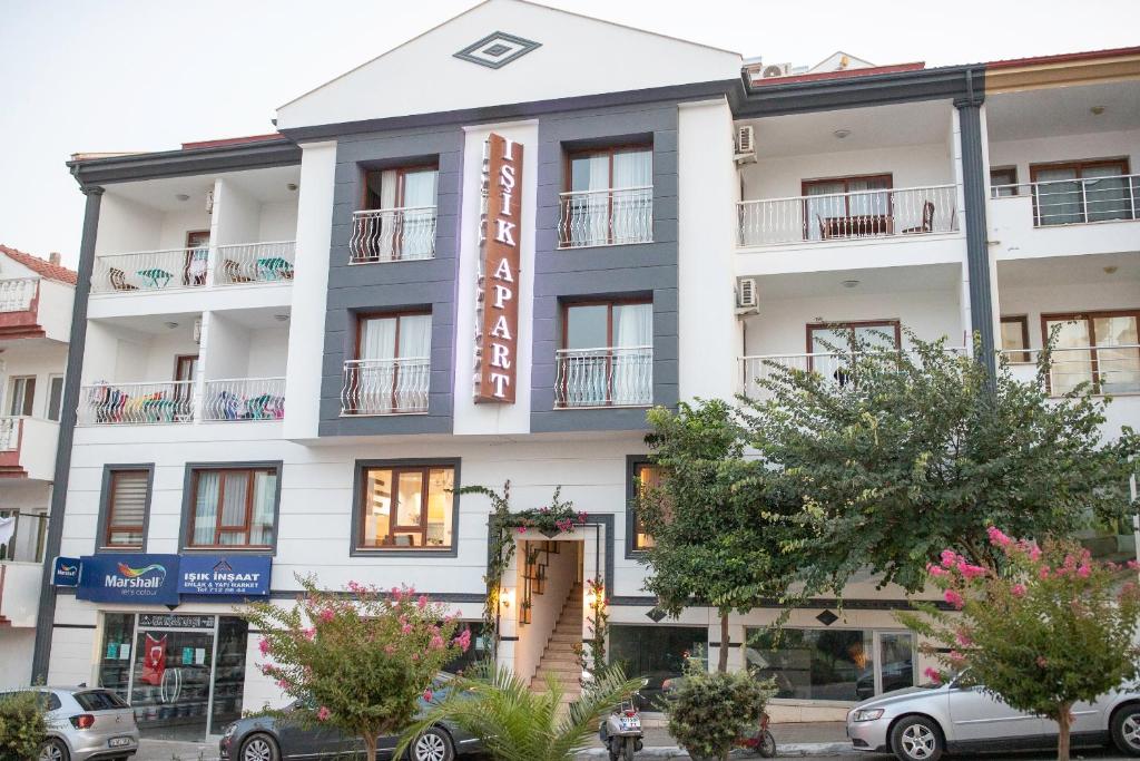 a white building with a sign on it at Datça Işık Apart in Datca