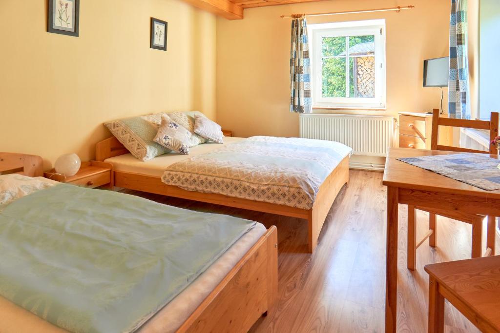 Una cama o camas en una habitación de Chata Harmonie