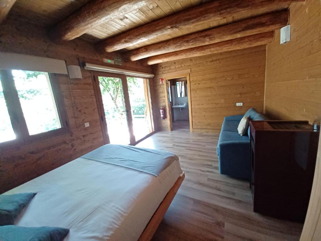 Postel nebo postele na pokoji v ubytování IRATIKO KABIAK