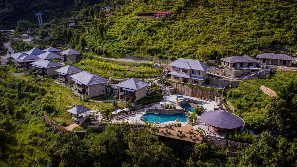 an aerial view of a house with a swimming pool at Dorje's Resort and Spa in Pokhara