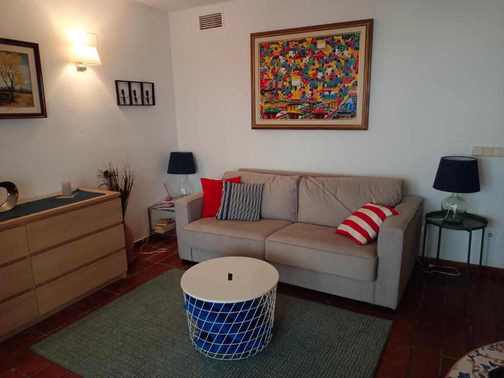 a living room with a couch and a coffee table at Apartamento Puerto Campomanes - Altea in Altea