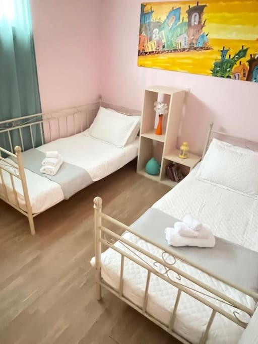 Postel nebo postele na pokoji v ubytování Sweet Makri Suite