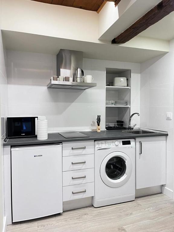 Kuchyň nebo kuchyňský kout v ubytování Apartamentos Numancia