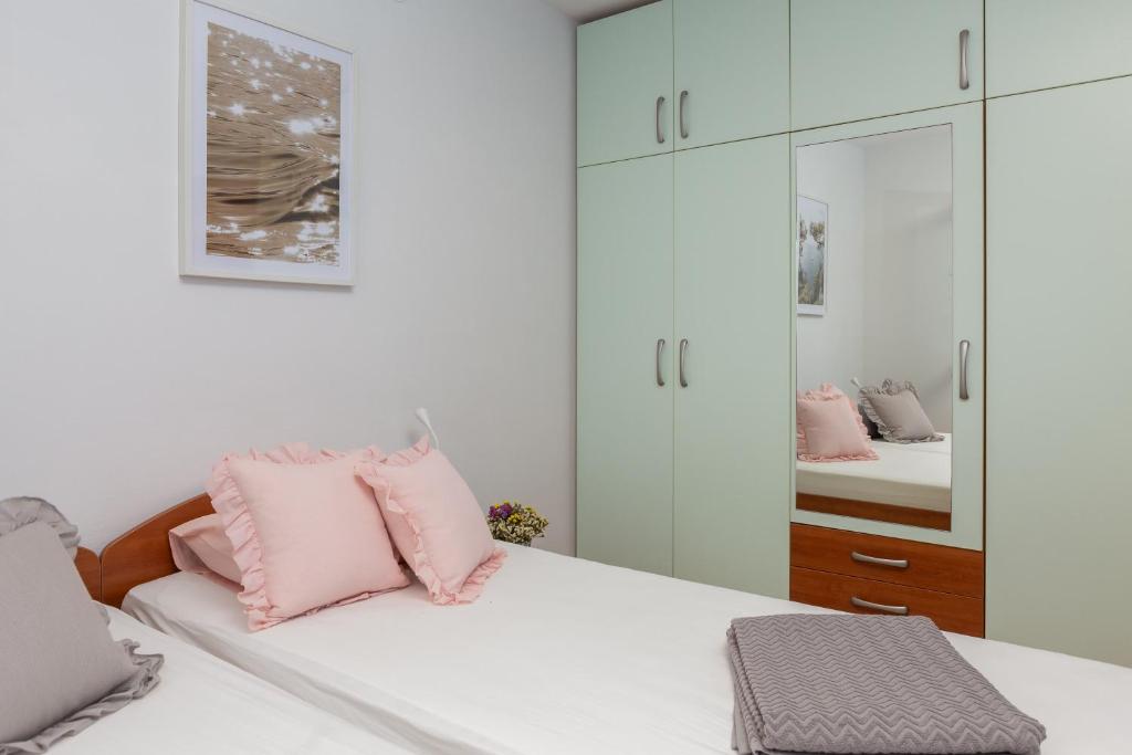 Łóżko lub łóżka w pokoju w obiekcie Maki Apartments