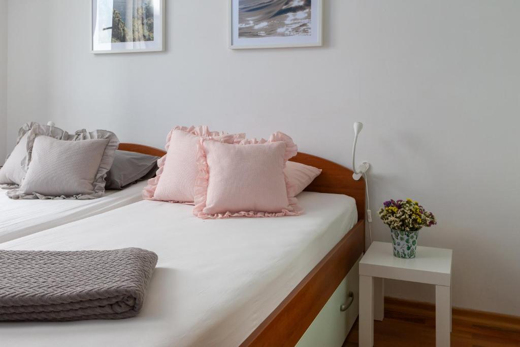 Łóżko lub łóżka w pokoju w obiekcie Maki Apartments