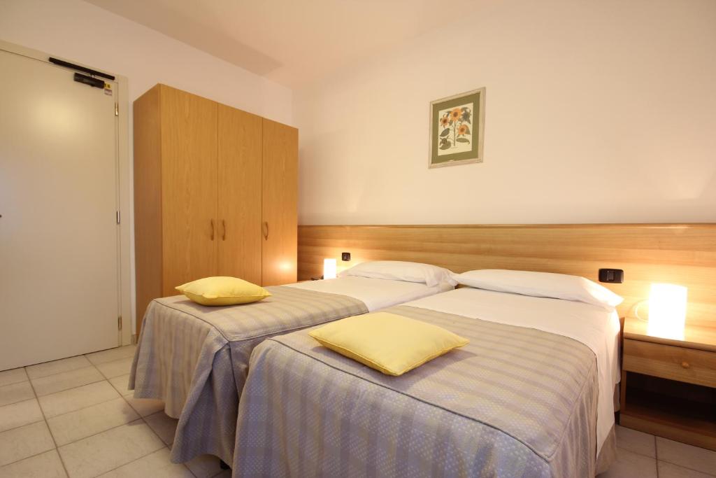 Postel nebo postele na pokoji v ubytování Hotel Miramare