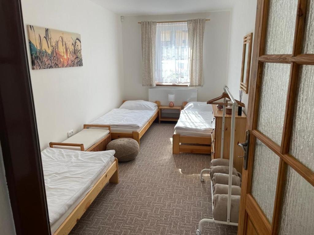 Posteľ alebo postele v izbe v ubytovaní Apartmány u Pálavy