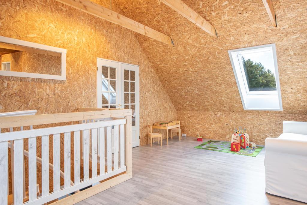 Letto o letti in una camera di Fuglhus - hyggelig ferie på landet