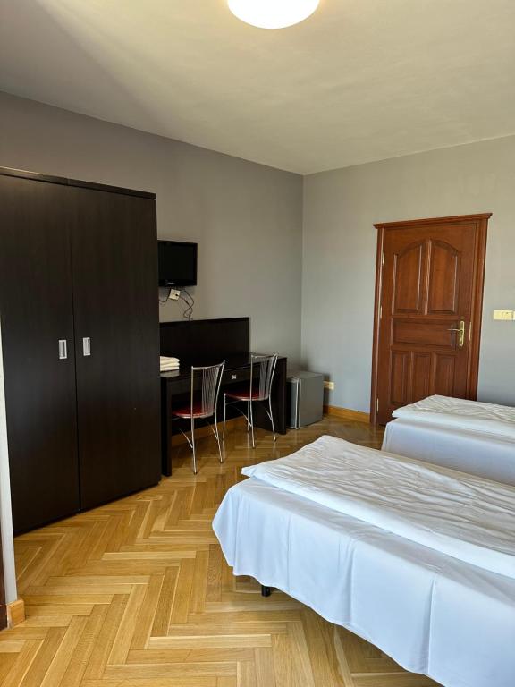 Postel nebo postele na pokoji v ubytování K2 Pokoje