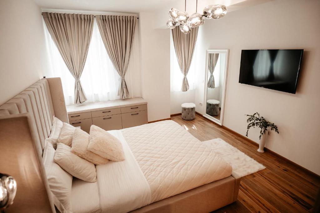 Posteľ alebo postele v izbe v ubytovaní Cosy apartment Bucovina