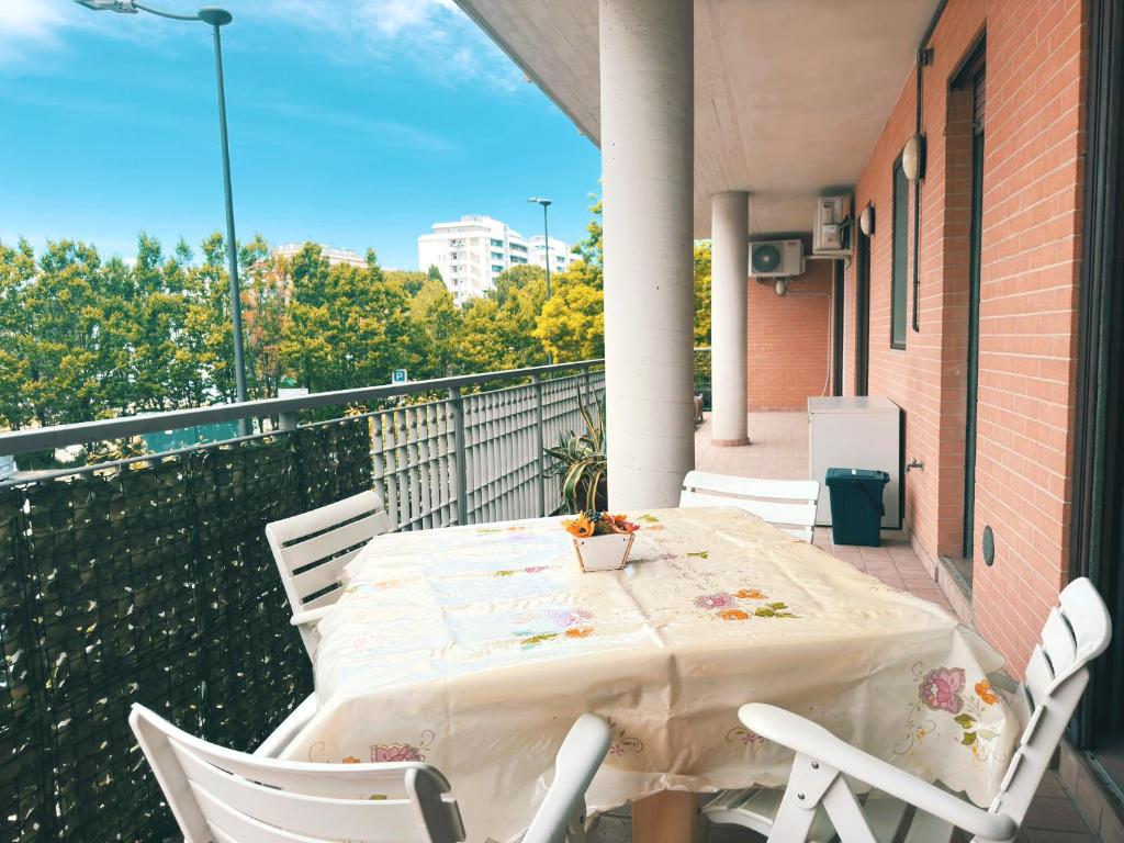 a white table and chairs on a balcony at La casa di Marcella in Pescara