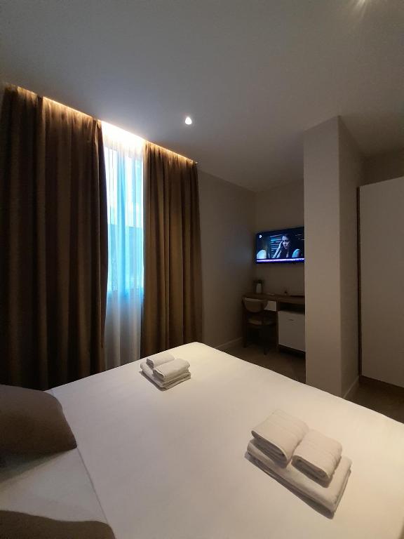 Postel nebo postele na pokoji v ubytování Solea Hotel