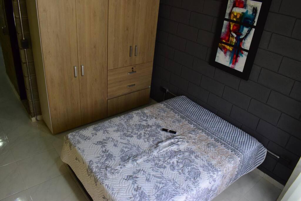 a mattress in the corner of a room at Apartamento en Cali in Cali