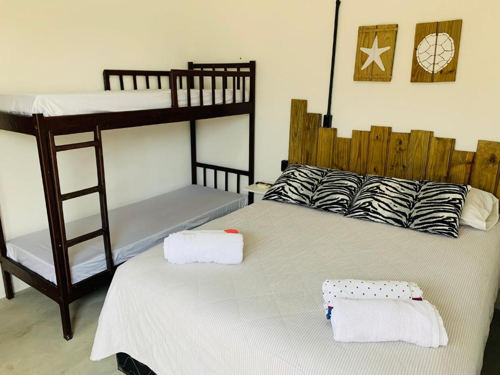 Postel nebo postele na pokoji v ubytování Suítes Cabanas Coral