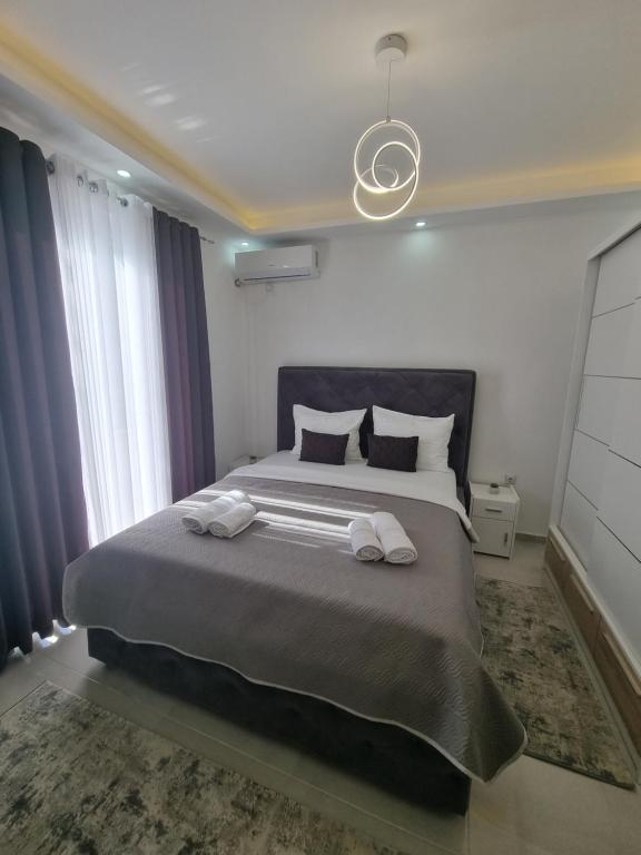 Postel nebo postele na pokoji v ubytování Kahari Apartments