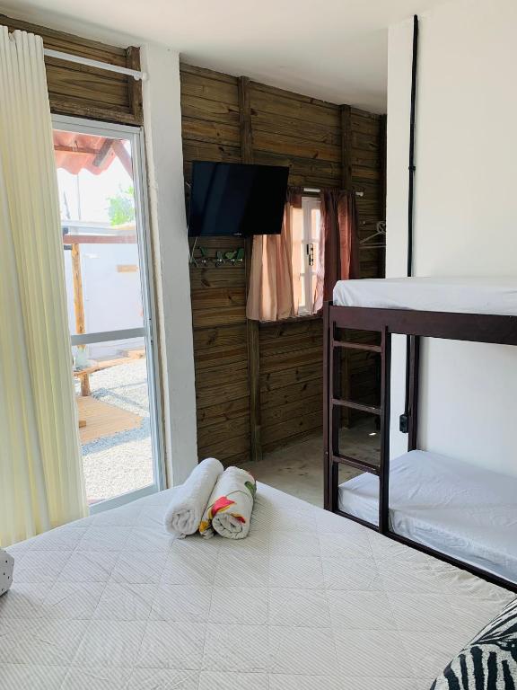 Postel nebo postele na pokoji v ubytování Suítes Cabanas Coral