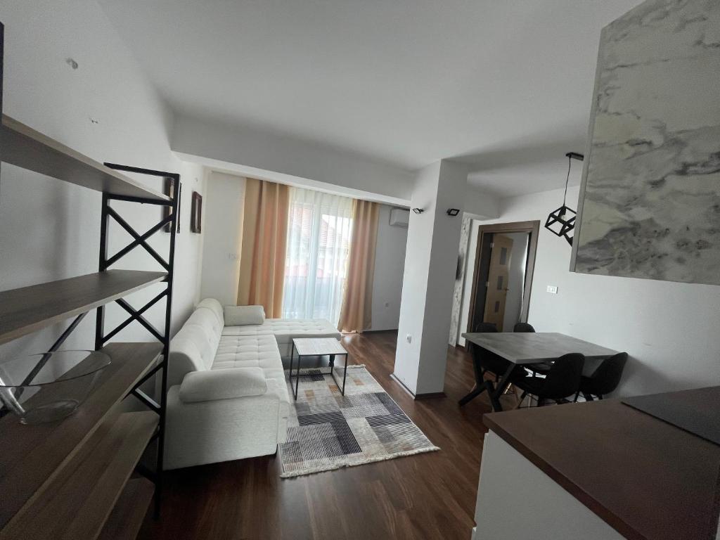 a living room with a white couch and a table at Skopje Kale Luxury Apartment in Skopje