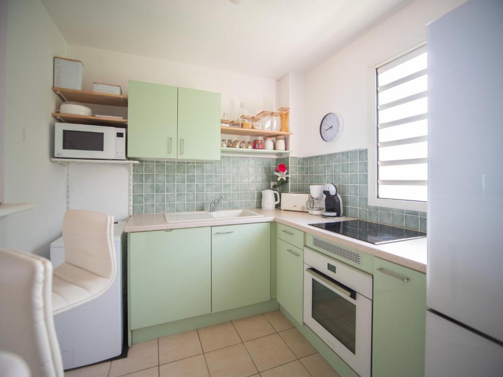 Cuisine ou kitchenette dans l'établissement L'Oiseau de Paradis - Vue Mer Panoramique