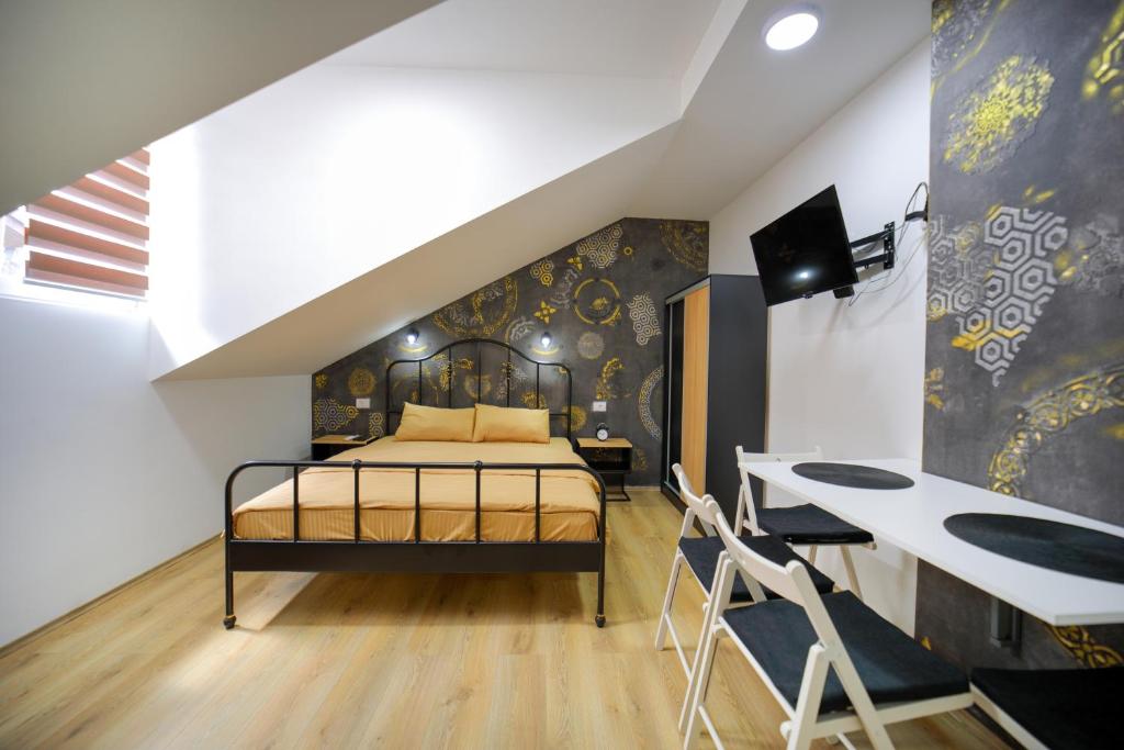 Postel nebo postele na pokoji v ubytování Apartmani Hedonist