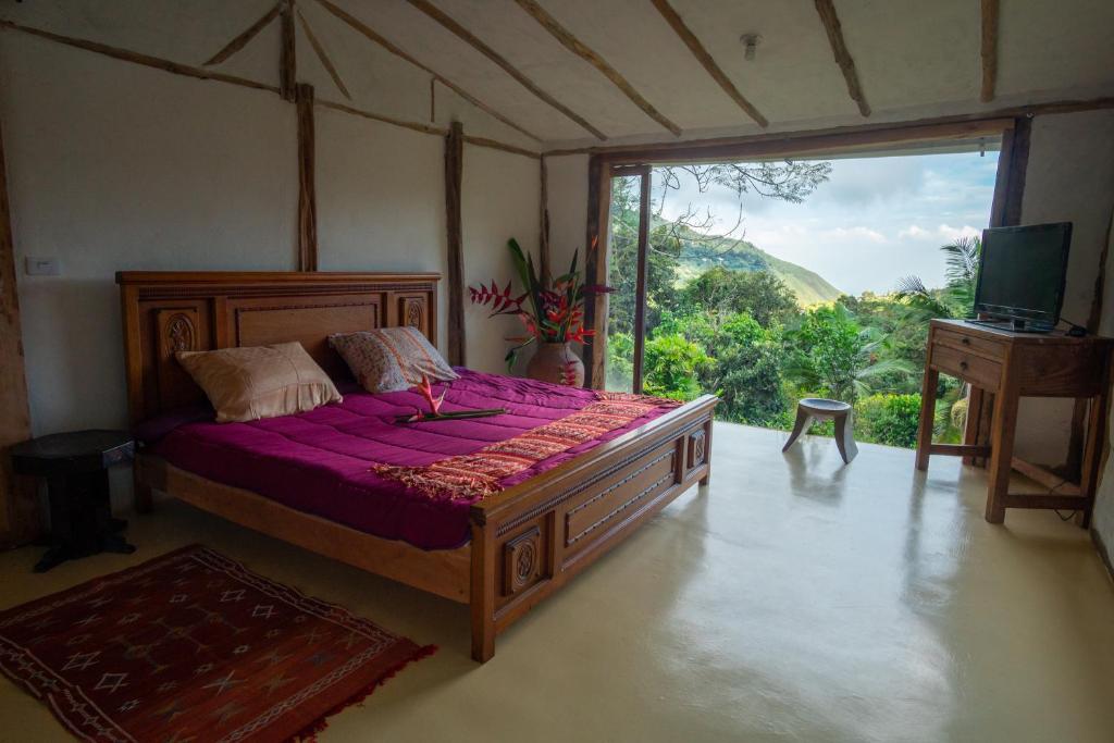 En eller flere senge i et værelse på Ecolodge Jaguarundi