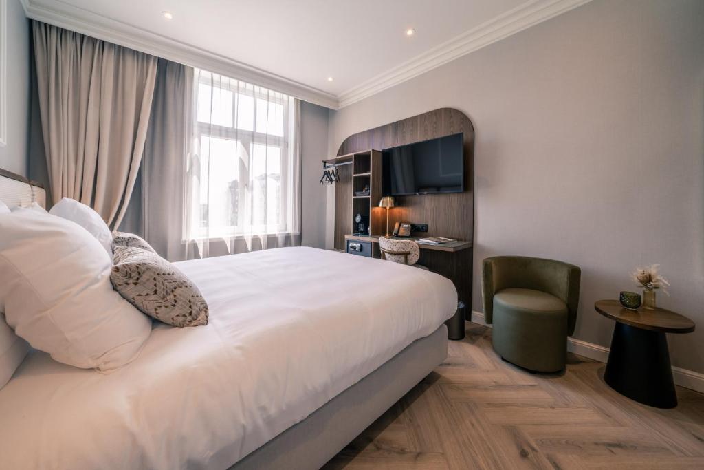 Postel nebo postele na pokoji v ubytování Hotel Du Parc