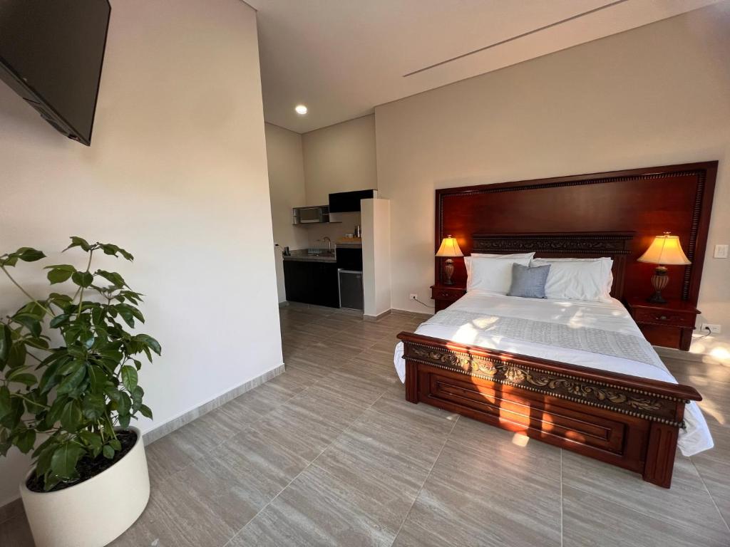 Postel nebo postele na pokoji v ubytování 1714 Hotel Boutique Guatapé