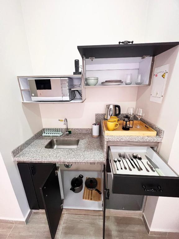 Kuchyň nebo kuchyňský kout v ubytování 1714 Hotel Boutique Guatapé