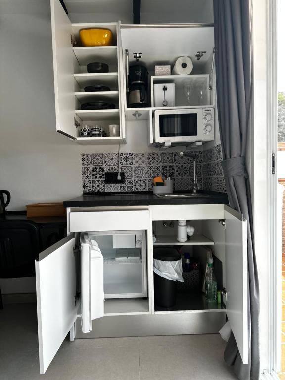 Kuchyň nebo kuchyňský kout v ubytování Increíble suite