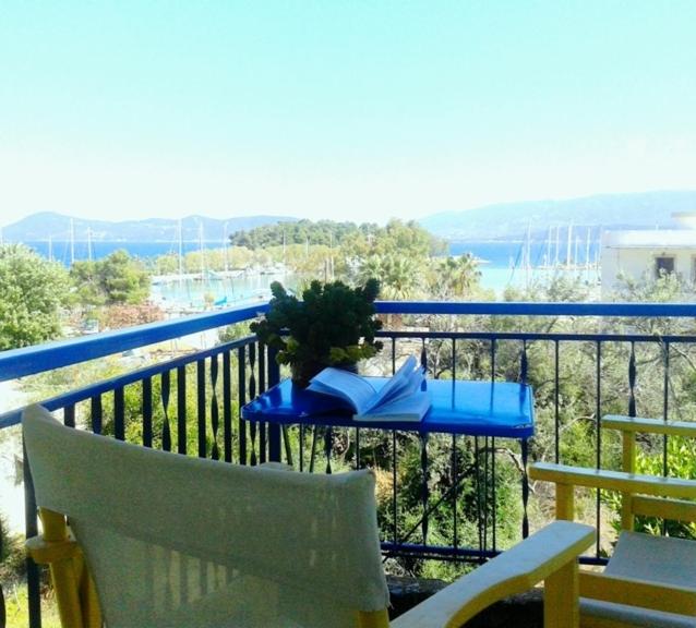 a balcony with a table with a plant on it at Anastasia Studios in Methana