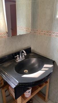 a bathroom with a black sink and a mirror at Mirador in Monterrey