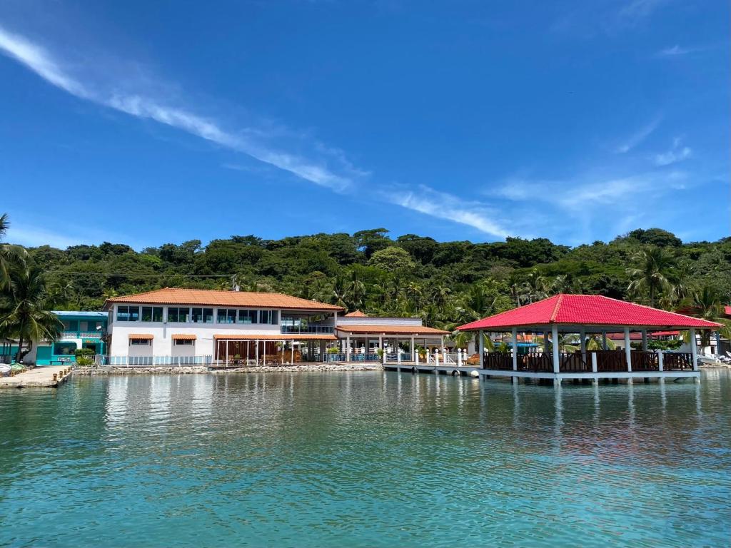 a group of buildings on a body of water at Hotel Candy Rose in Colón