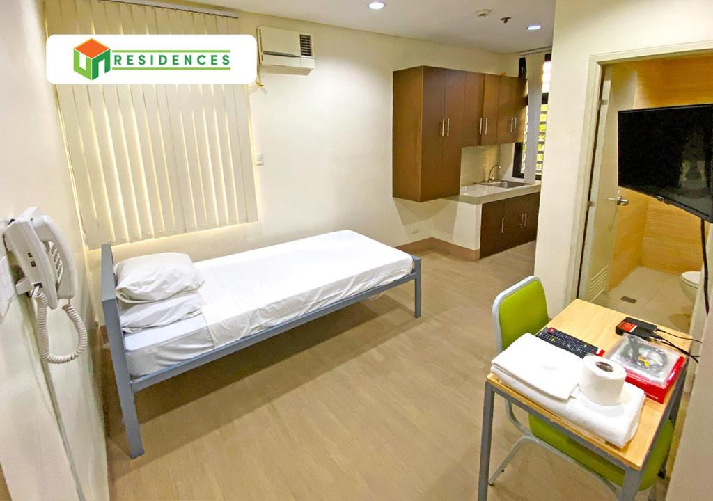 Postel nebo postele na pokoji v ubytování UN Residences