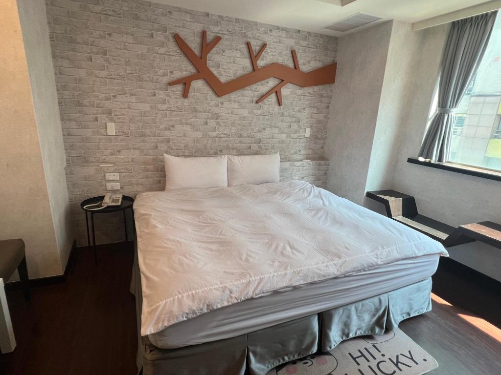 Postel nebo postele na pokoji v ubytování Kaili Hot Spring Hotel