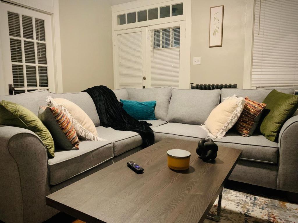 a living room with a couch and a coffee table at 2br Hideaway just 2 miles from Beale St and Overton Square! in Memphis