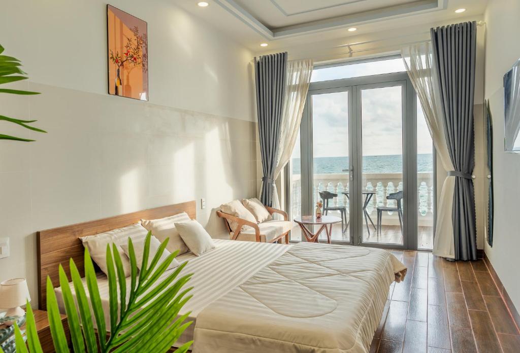 En eller flere senge i et værelse på Mien Trung Beach House Phu Quoc