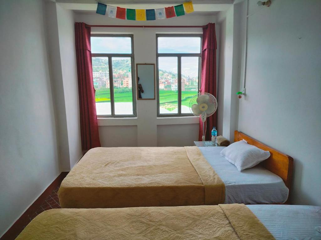 Postel nebo postele na pokoji v ubytování COMMUNITY HOLIDAY INN