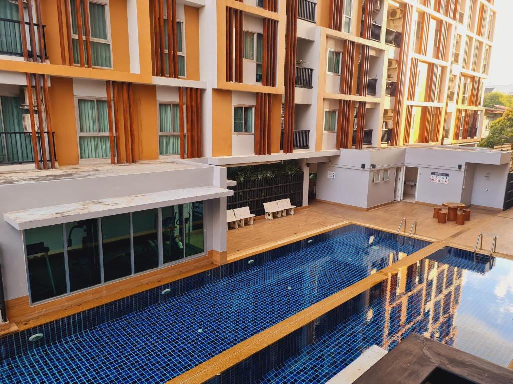 an overhead view of a building with a swimming pool at 1 Double bedroom Swimming pool Apartment for Rent in UdonThani With Gym Laundry in Udon Thani