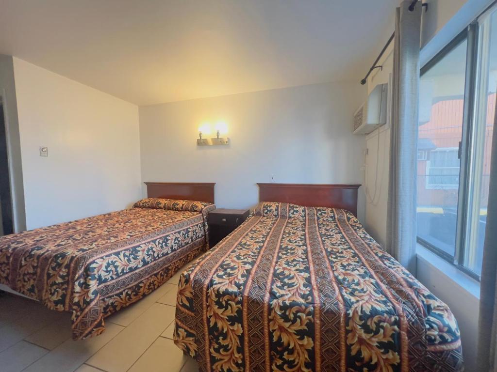 Postel nebo postele na pokoji v ubytování Dry Dock Motel