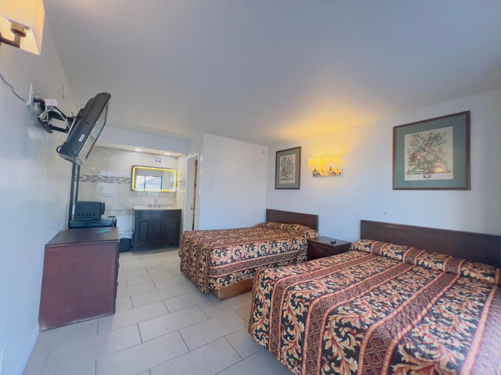 Postel nebo postele na pokoji v ubytování Dry Dock Motel