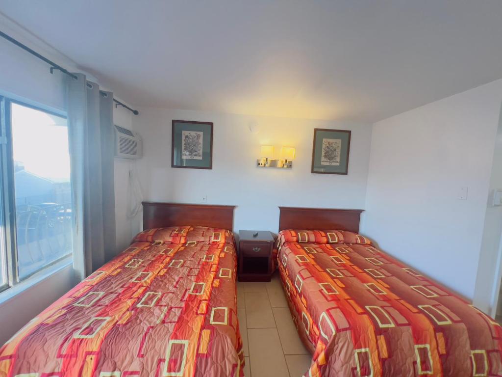 Postel nebo postele na pokoji v ubytování Dry Dock Motel