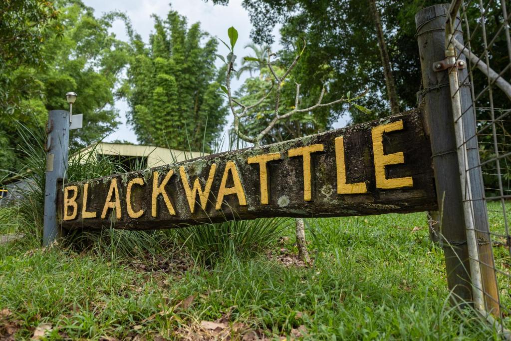 a wooden sign that reads black wallie at Blackwattle Farm in Beerwah