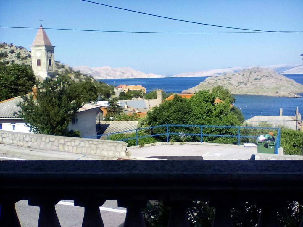 a view from a balcony of a town and a church at Apartman MICHI in Sveti Juraj