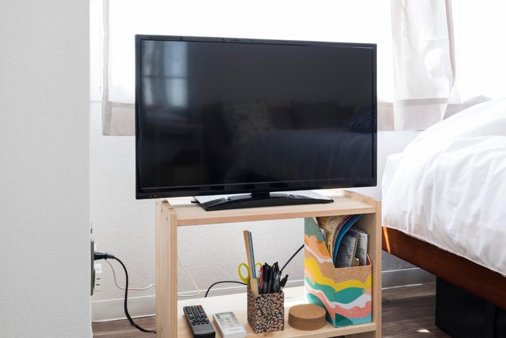 TV a/nebo společenská místnost v ubytování Kami Inn