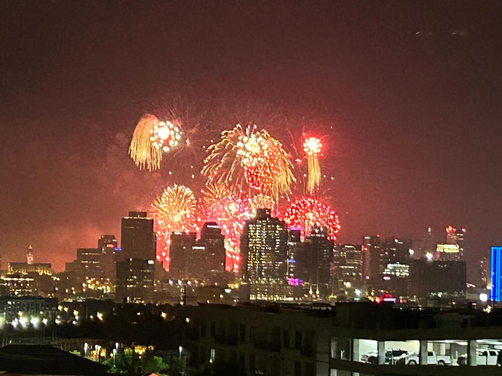 a fireworks display over a city at night at Luxury Townhome Skyline Views Mins To DT in Nashville