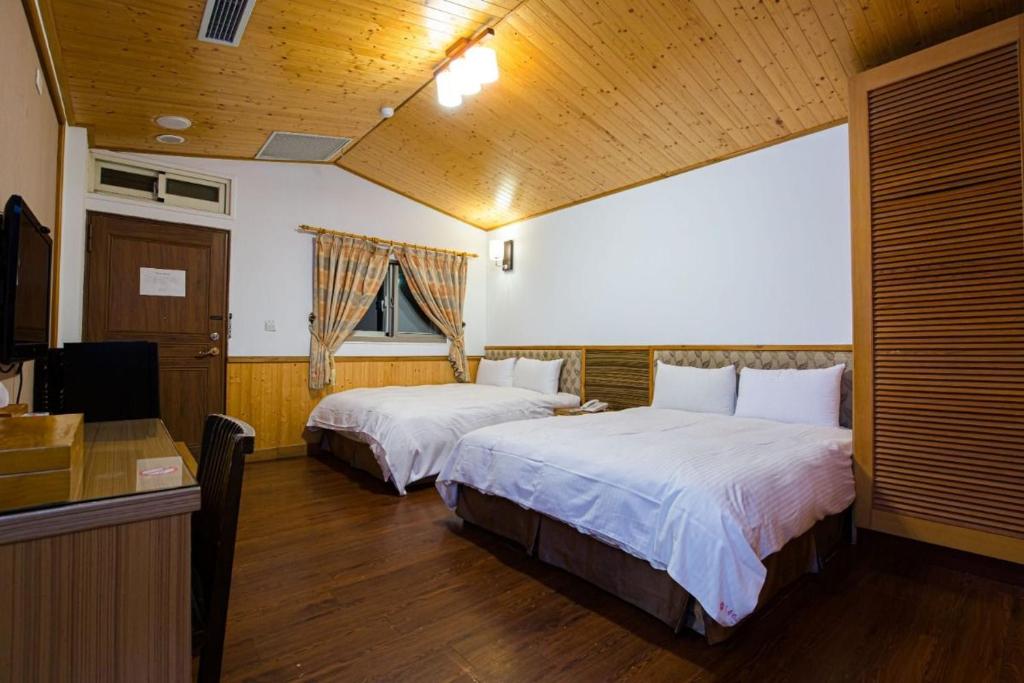 Dragon Manor Resort - Salle Quadruple Standard