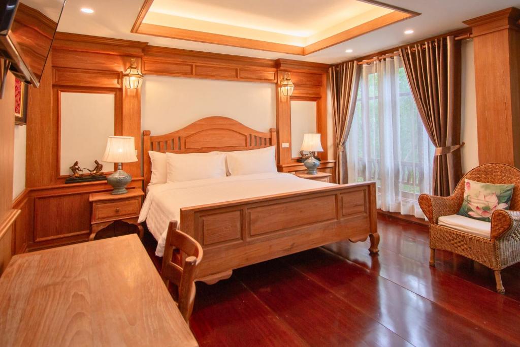 Postel nebo postele na pokoji v ubytování Rich Garden House Hotel